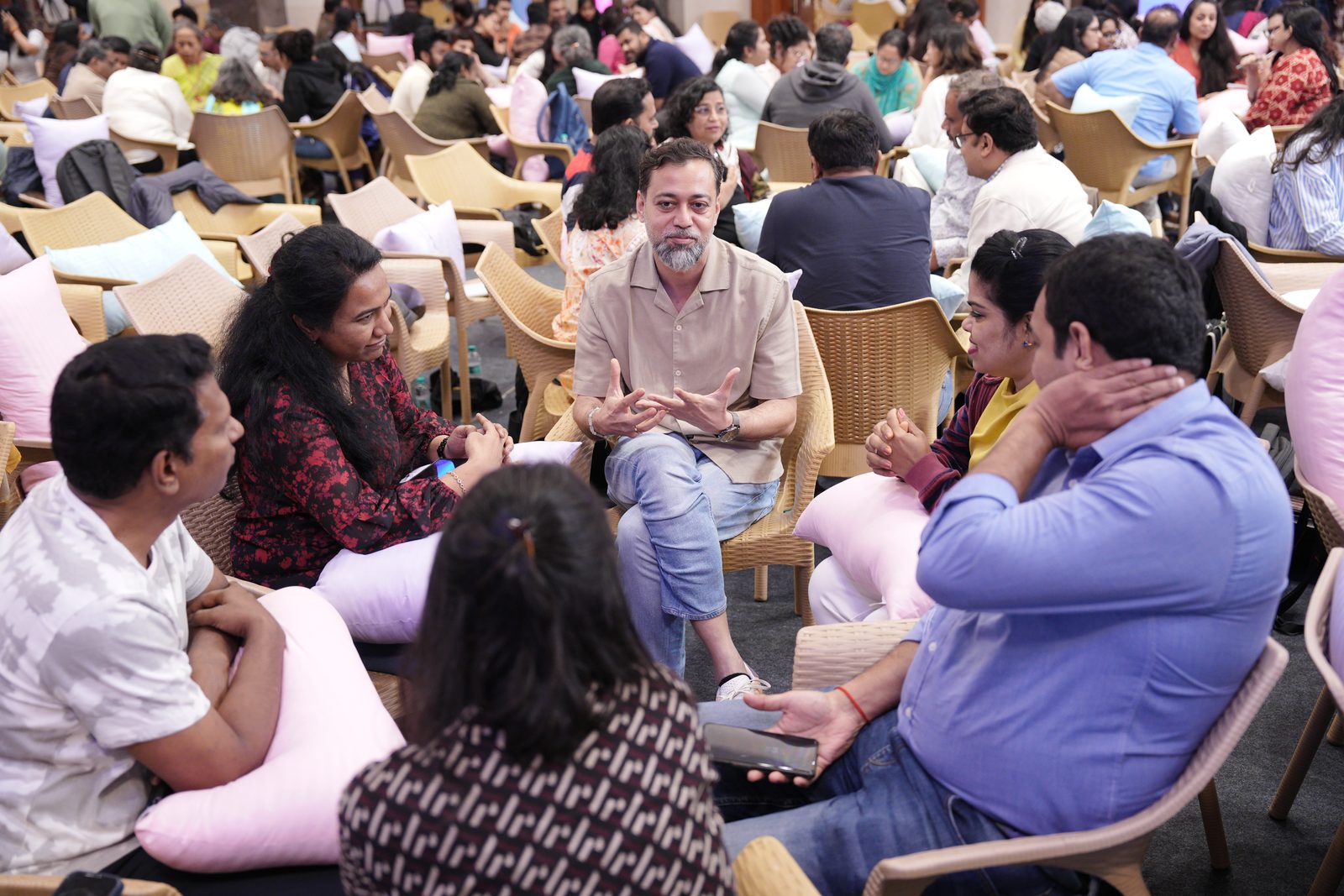 A small group of leaders in a circle working through a real situation together
